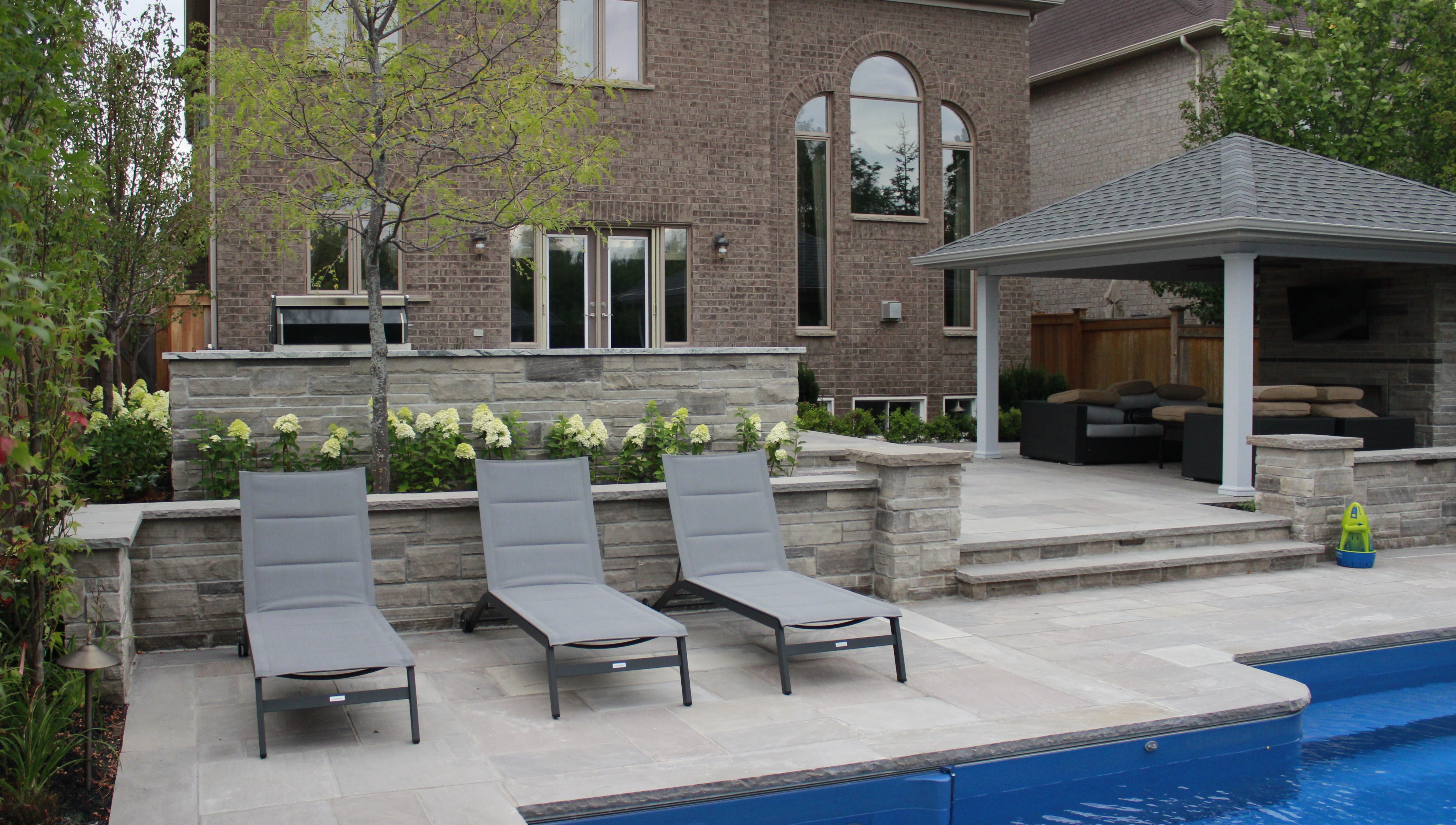 pool landscaping, flagstone, softscape, retaining wall, steps, cabana,